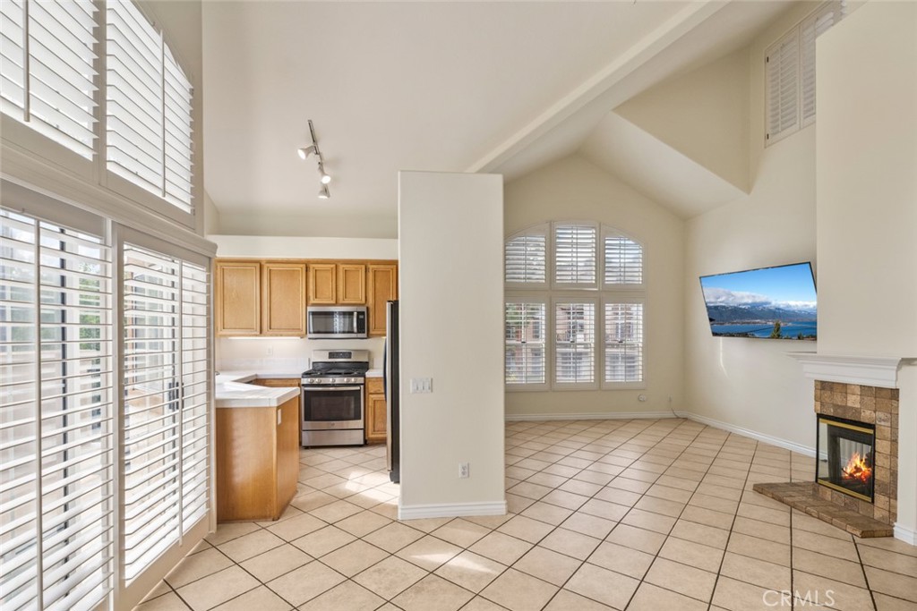 5 Montara Drive Aliso Viejo, CA 92656 - Photo 3 of 26 a view of a kitchen with microwave and a stove top oven
