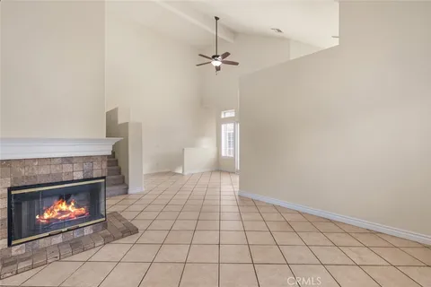 a view of an empty room and a fire place