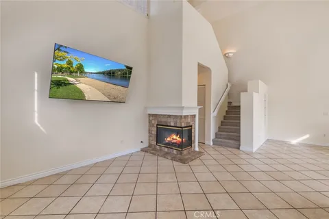 a view of an empty room with a fireplace