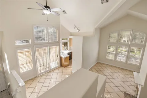 a spacious bedroom with a large bed and a window