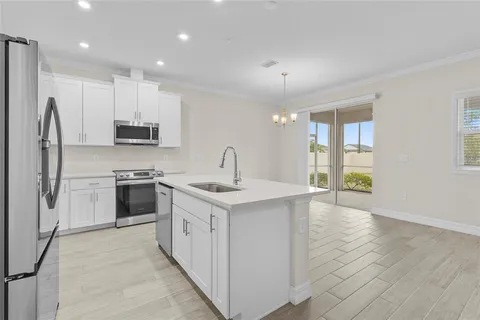a kitchen with a sink and a window