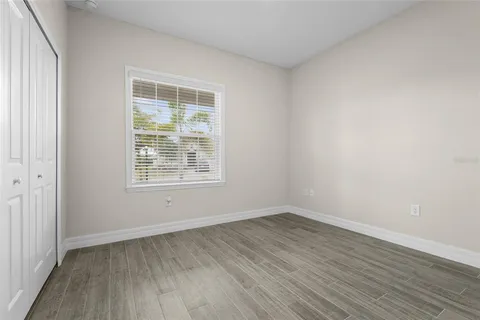 an empty room with wooden floor