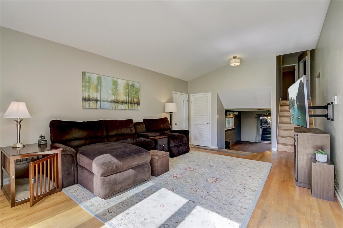 212 Voltz Road Northbrook, IL 60062 - Photo 3 of 30 a living room with furniture and a fireplace