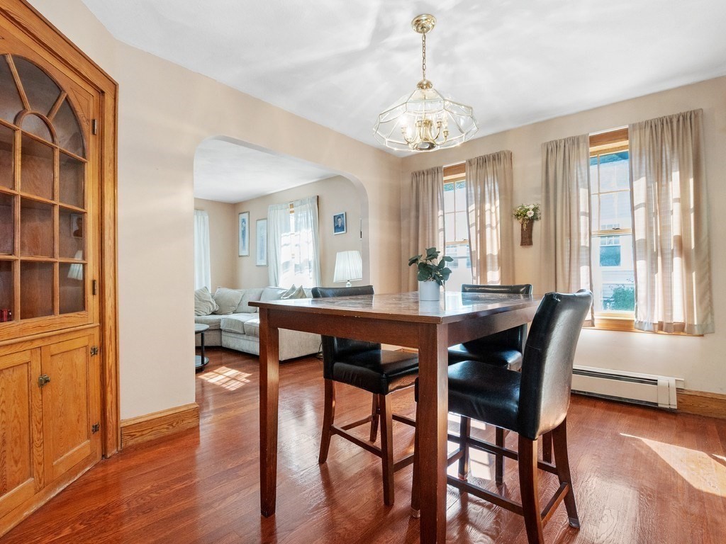14 Willard Street Waltham, MA 02451 - Photo 16 of 36 a view of a dining room with furniture window and wooden floor