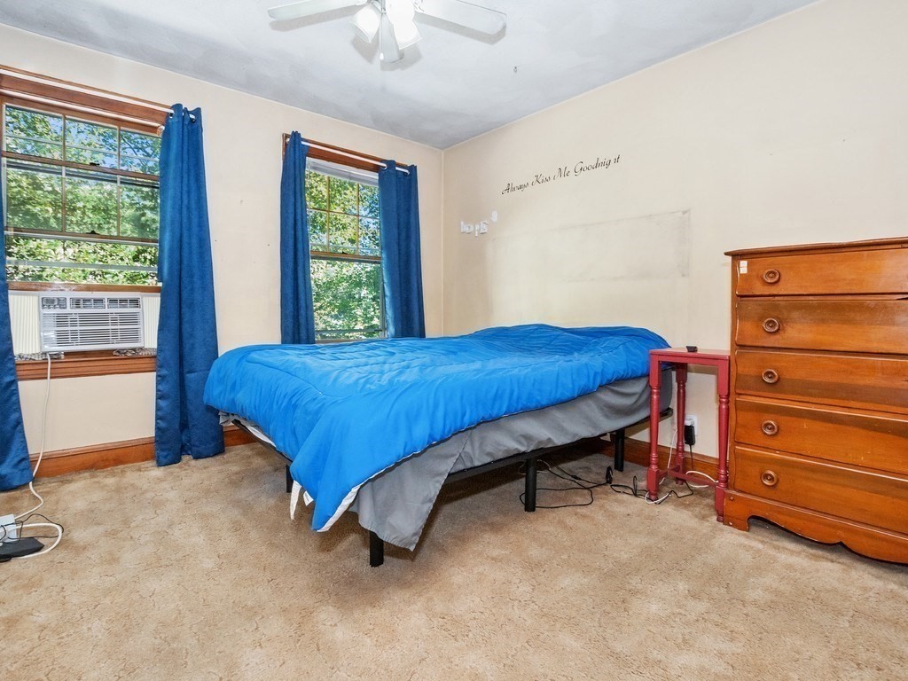 14 Willard Street Waltham, MA 02451 - Photo 21 of 36 a bed sitting in a room next to a window