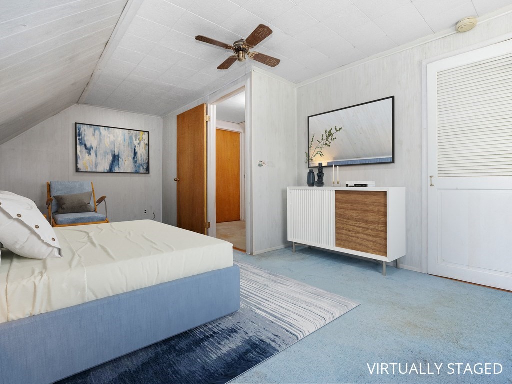 14 Willard Street Waltham, MA 02451 - Photo 22 of 36 a room with a bed and ceiling fan