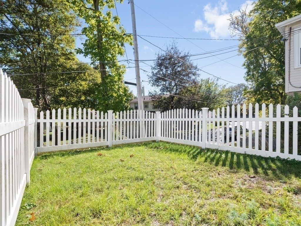 14 Willard Street Waltham, MA 02451 - Photo 27 of 36 a view of a yard with wooden fence