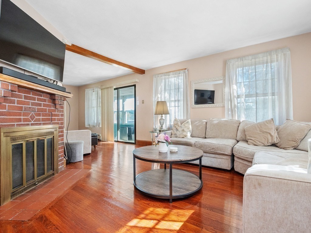 14 Willard Street Waltham, MA 02451 - Photo 8 of 36 a living room with furniture and a fireplace