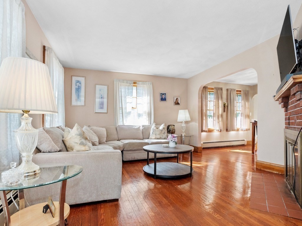 14 Willard Street Waltham, MA 02451 - Photo 9 of 36 a living room with furniture and a flat screen tv