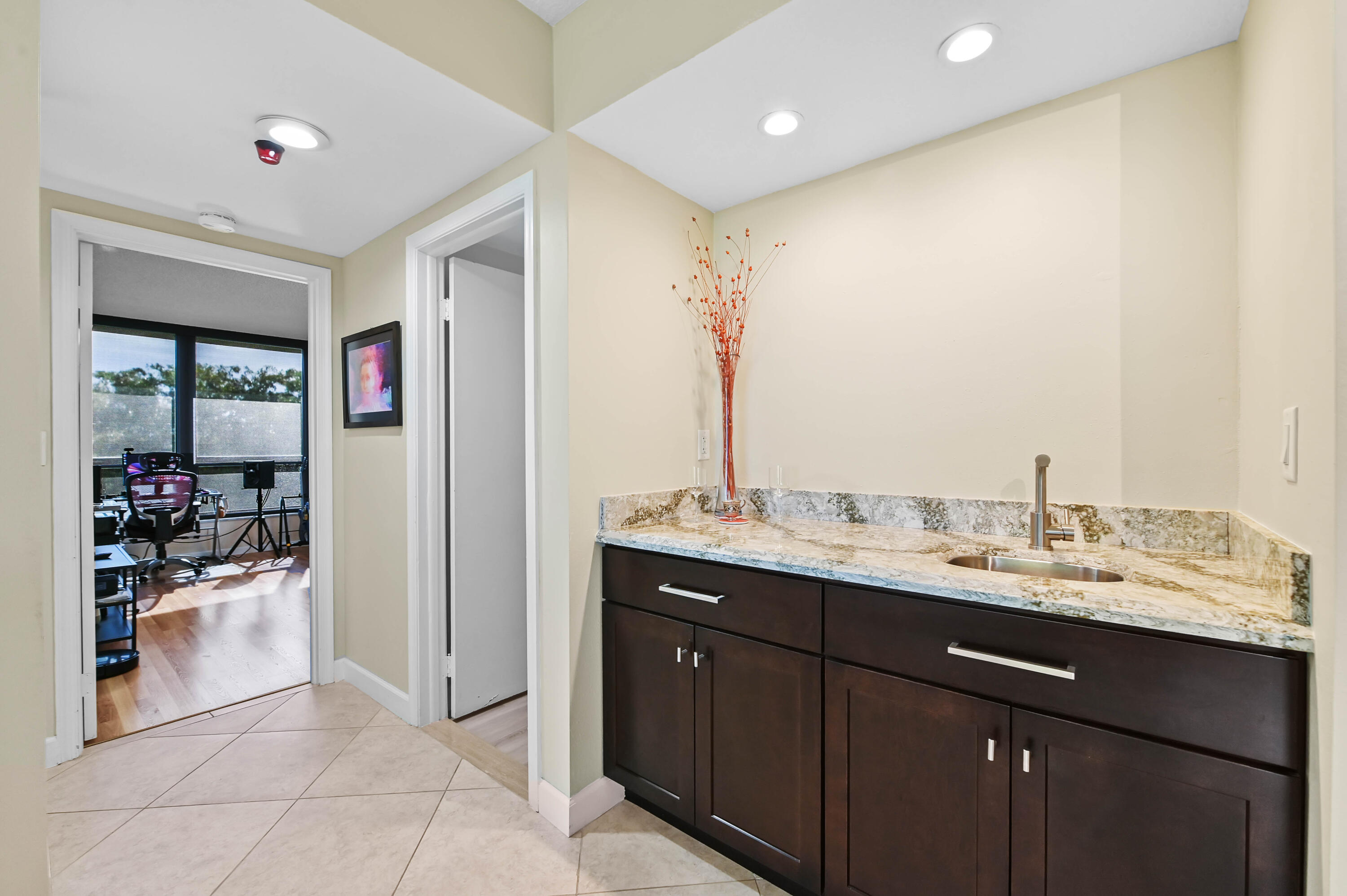5951 Wellesley Park Drive, Unit 702 Boca Raton, FL 33433 - Photo 20 of 26 a view of bathroom with a sink and mirror