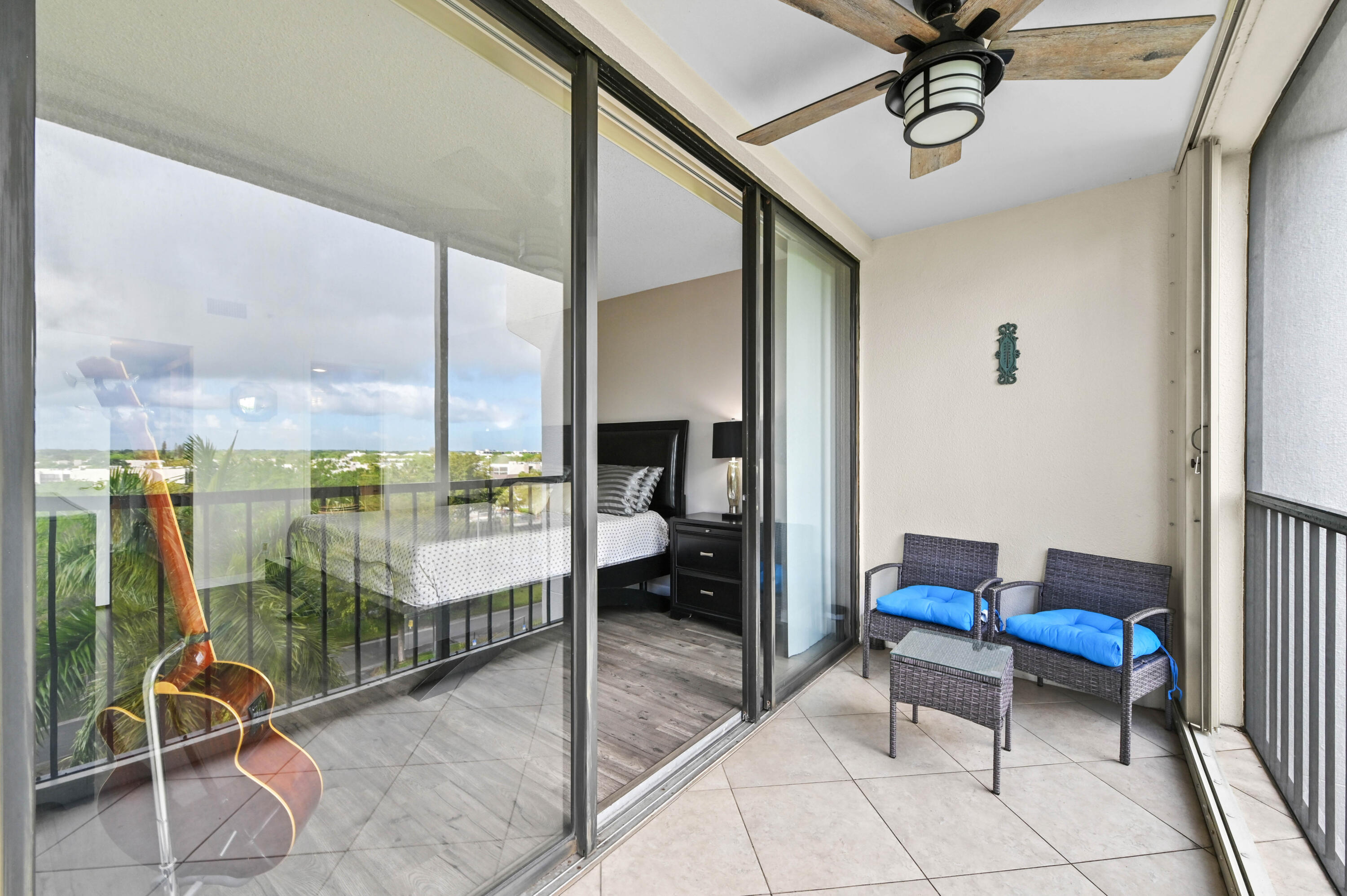 5951 Wellesley Park Drive, Unit 702 Boca Raton, FL 33433 - Photo 22 of 26 a room with patio
