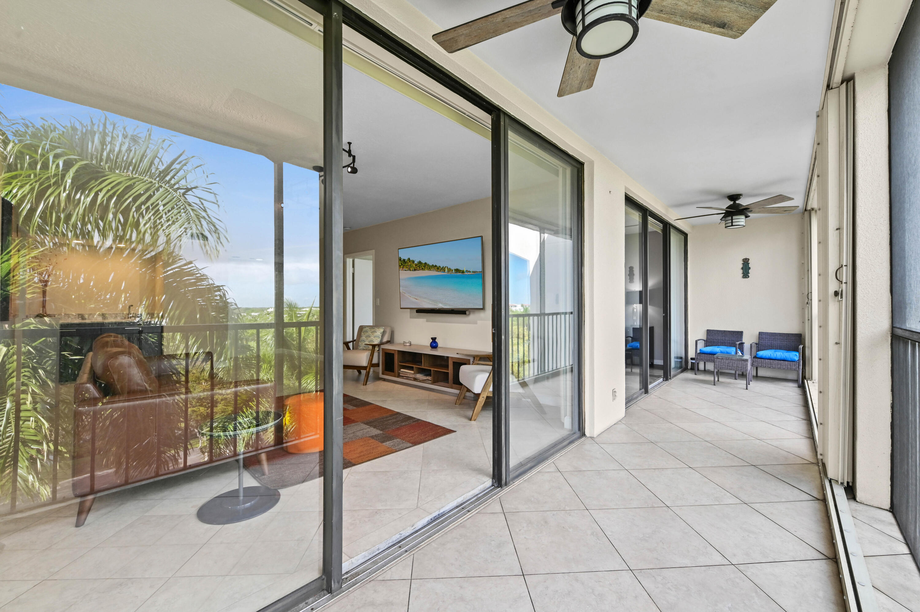 5951 Wellesley Park Drive, Unit 702 Boca Raton, FL 33433 - Photo 23 of 26 a view of a livingroom with furniture and floor to ceiling window