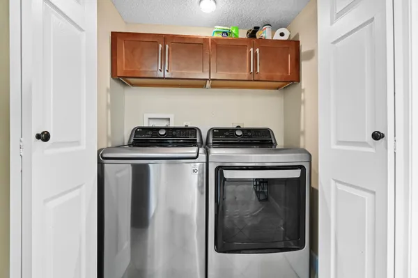 a kitchen with stainless steel appliances granite countertop a stove and a refrigerator