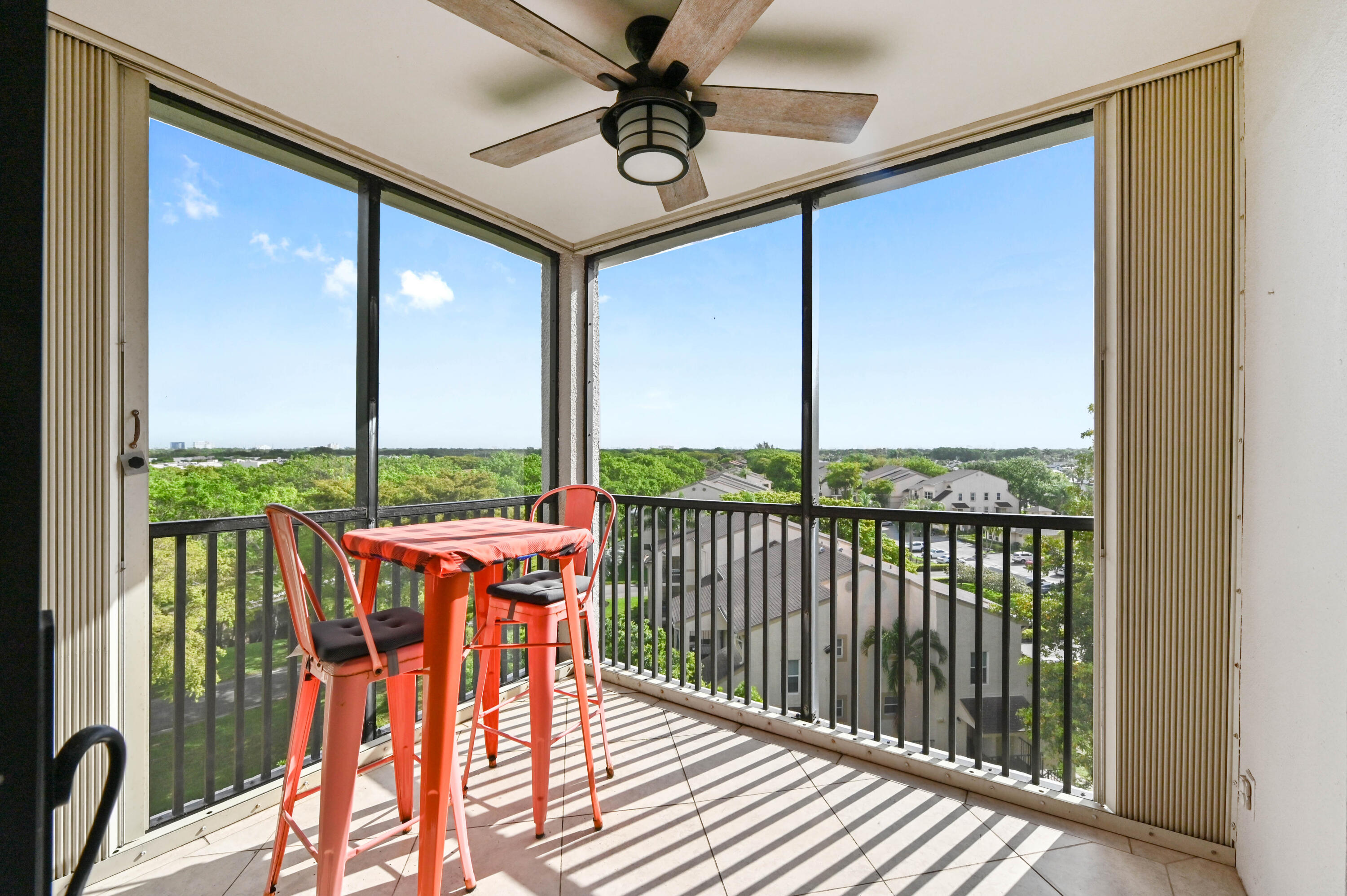 5951 Wellesley Park Drive, Unit 702 Boca Raton, FL 33433 - Photo 10 of 26 a balcony with an outdoor view and a potted plant