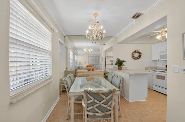 a kitchen with a white cabinets and white appliances