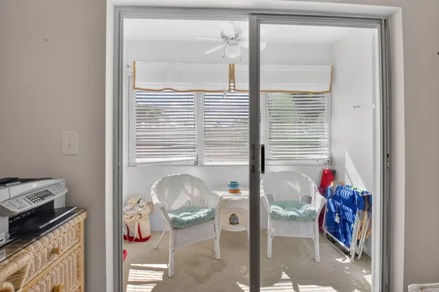 a bathroom with a sink mirror and toilet