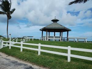 5505 North Ocean Boulevard, Unit 8204 Ocean Ridge, FL 33435 - Photo 2 of 47 a front view of a house with a yard