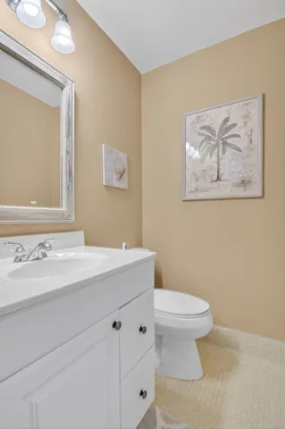 a bedroom with a bed and a computer on the desk