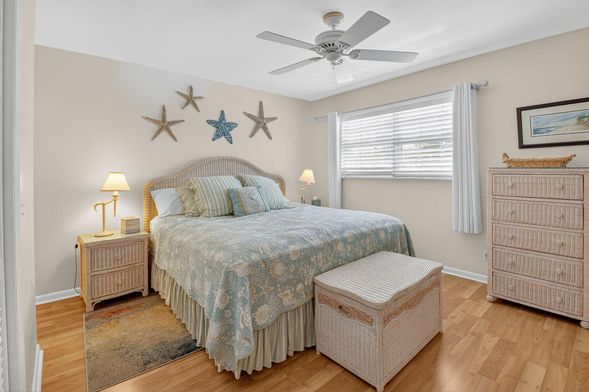 5505 North Ocean Boulevard, Unit 8204 Ocean Ridge, FL 33435 - Photo 22 of 47 a bedroom with a bed and a chandelier