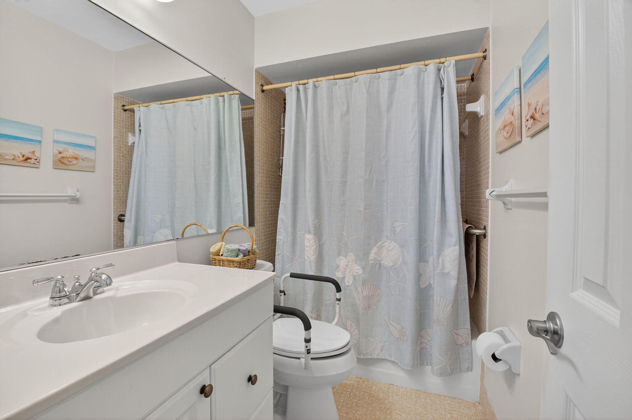5505 North Ocean Boulevard, Unit 8204 Ocean Ridge, FL 33435 - Photo 24 of 47 a bathroom with a sink a toilet and shower curtain