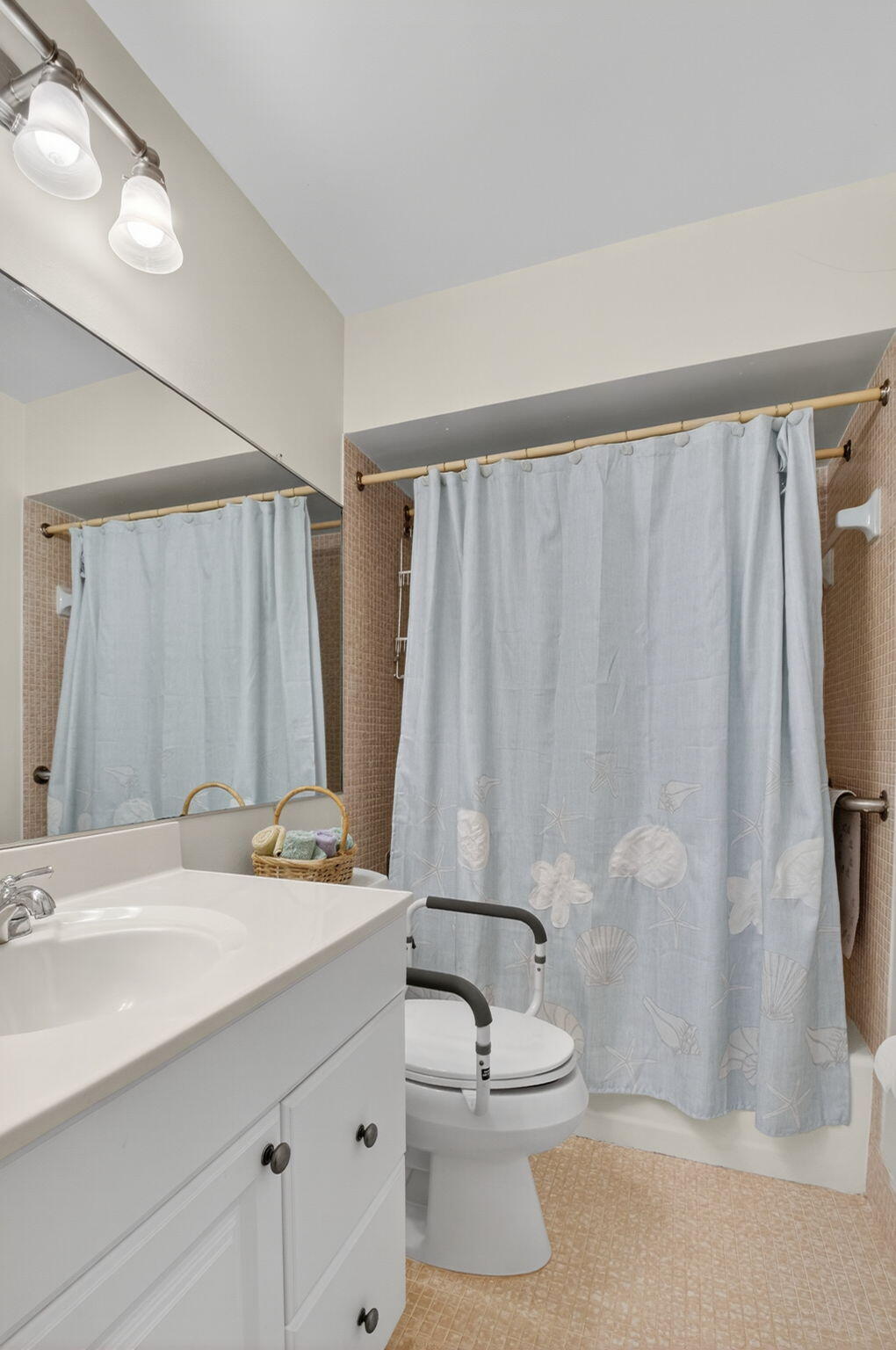 5505 North Ocean Boulevard, Unit 8204 Ocean Ridge, FL 33435 - Photo 25 of 47 a bathroom with a sink a toilet and shower