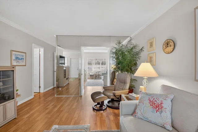 a view of a dining room with furniture and a chandelier