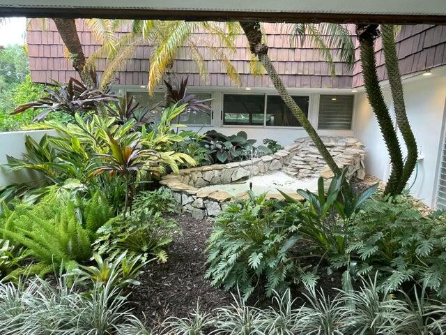 1225 Northwest 21st Street, Unit 343414 Stuart, FL 34994 - Photo 19 of 31 a view of a backyard with plants