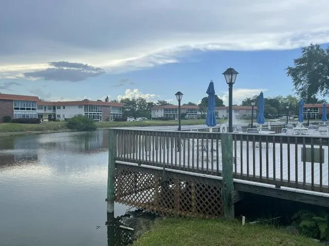 a view of a lake with a yard