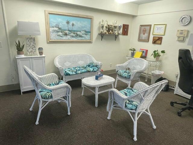 1225 Northwest 21st Street, Unit 343414 Stuart, FL 34994 - Photo 28 of 31 a dining room with furniture and wooden floor