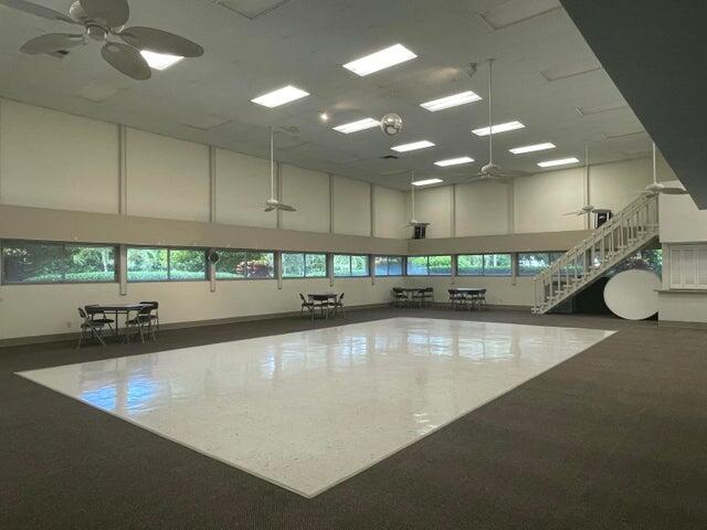 1225 Northwest 21st Street, Unit 343414 Stuart, FL 34994 - Photo 29 of 31 a large white kitchen with a large window