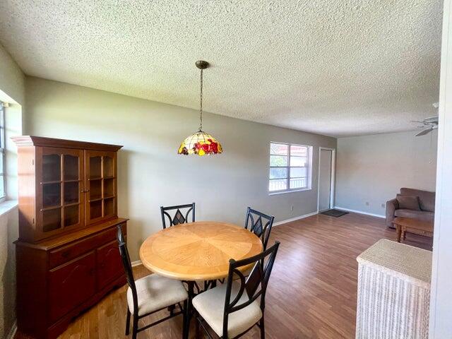 1225 Northwest 21st Street, Unit 343414 Stuart, FL 34994 - Photo 6 of 31 a view of a dining room with furniture