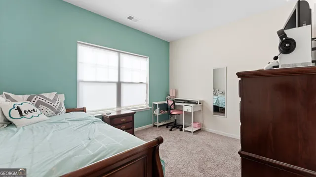 a view of a house with a backyard porch and sitting area