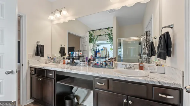 a bathroom with a tub and shower