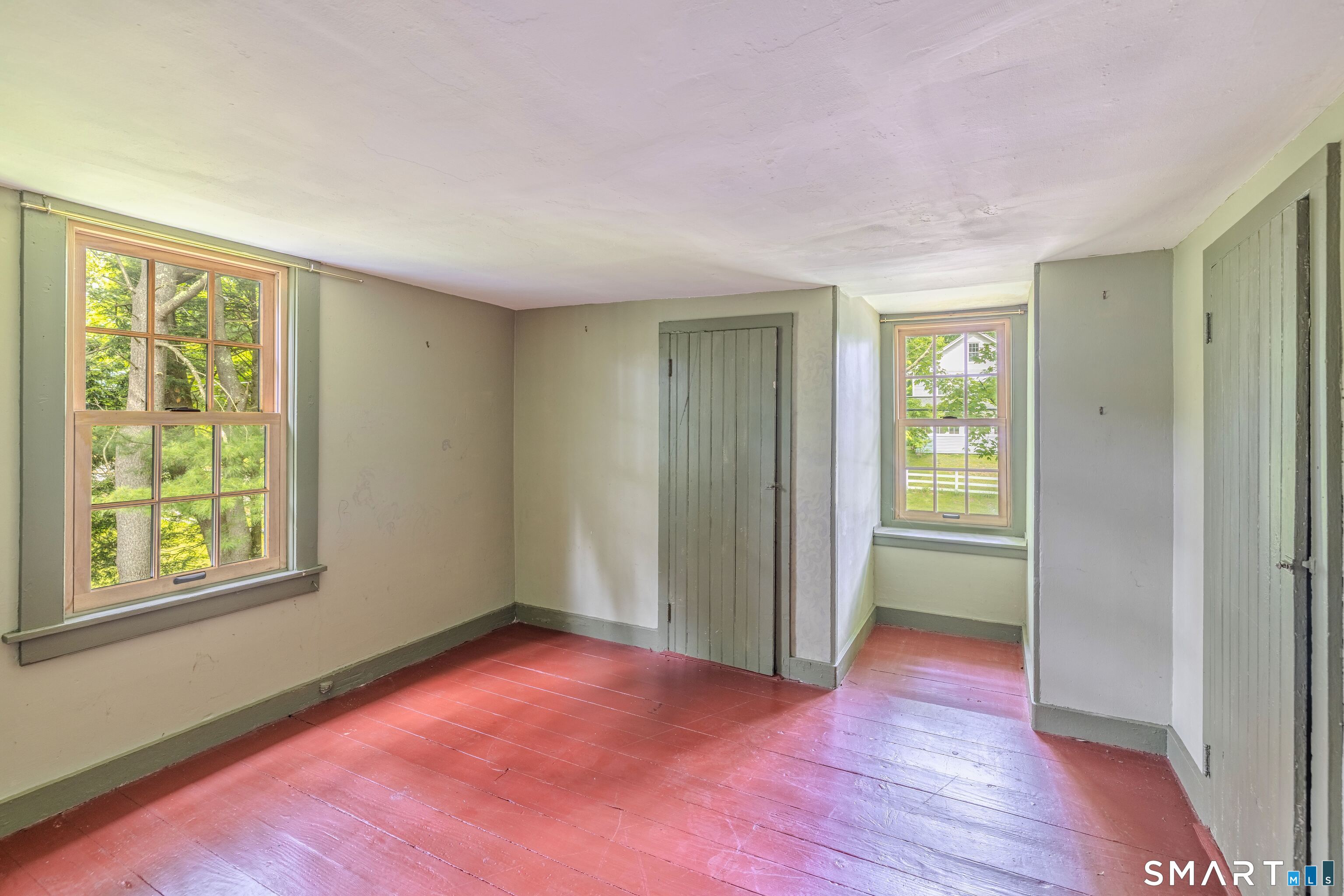 261 Hebron Road Bolton, CT 06043 - Photo 25 of 40 an empty room with windows and closet