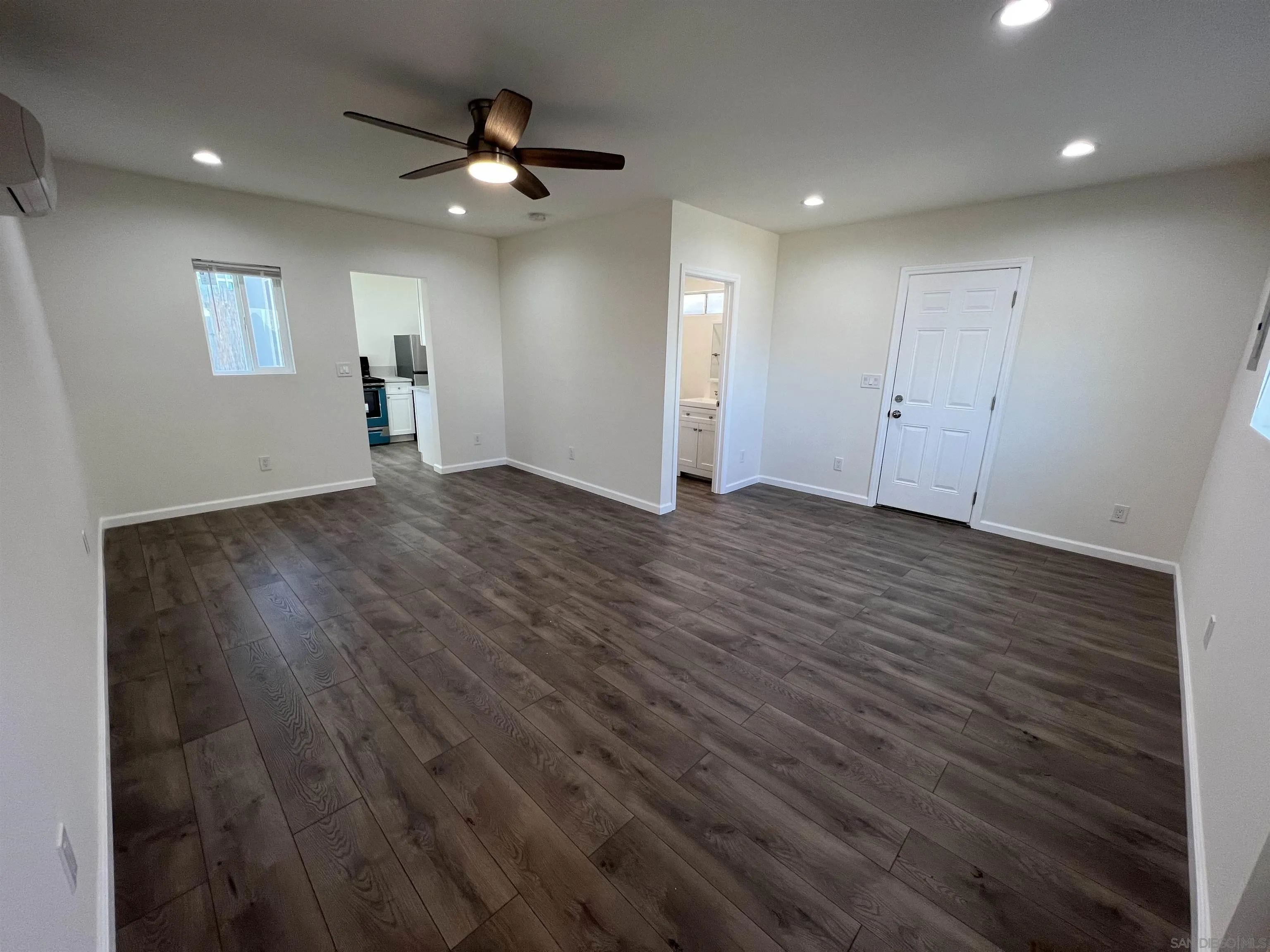 1223 Division Street Oceanside, CA 92054 - Photo 14 of 14 an empty room with wooden floor and windows