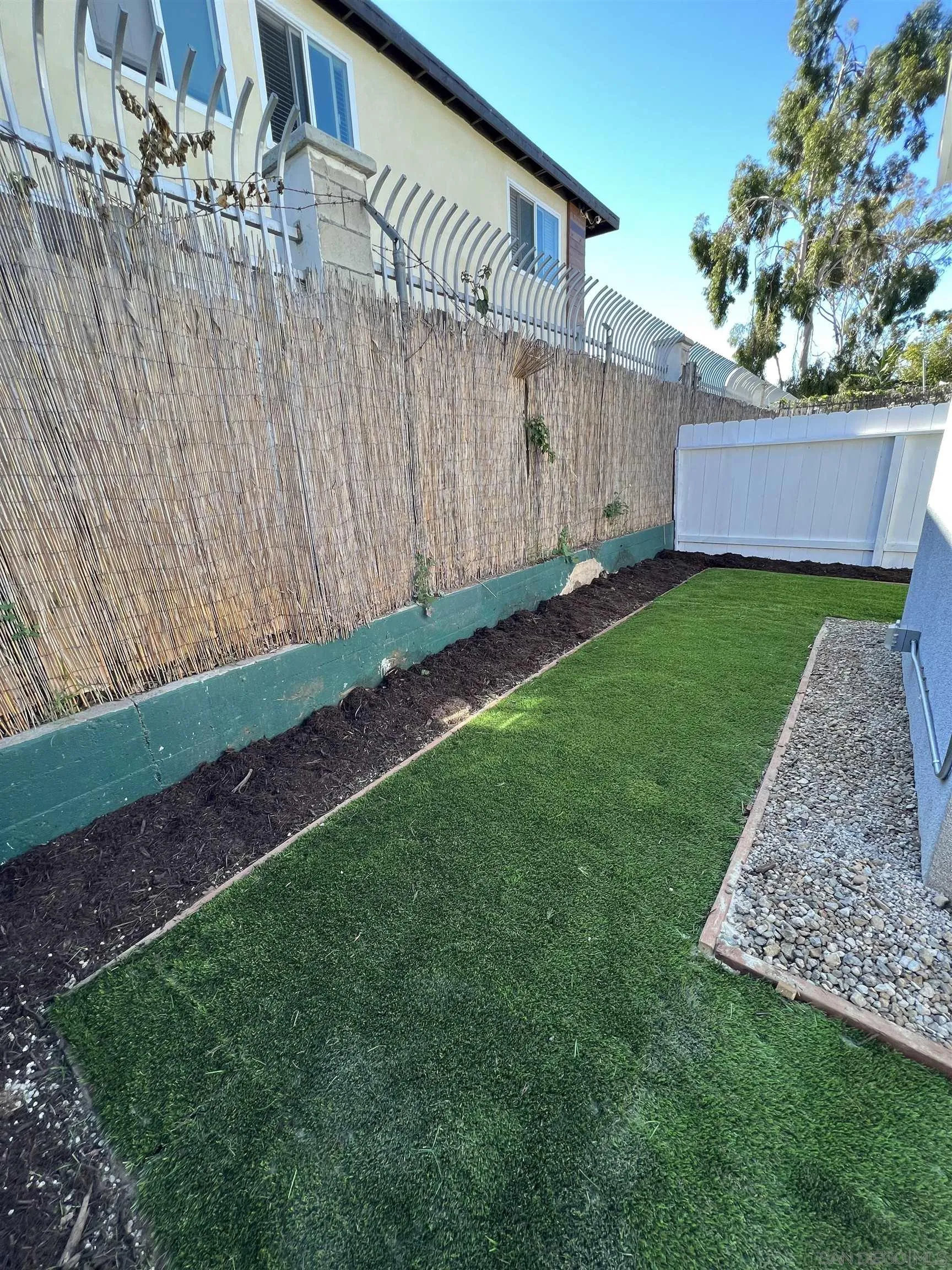 1223 Division Street Oceanside, CA 92054 - Photo 10 of 14 a backyard of a house with lots of green space