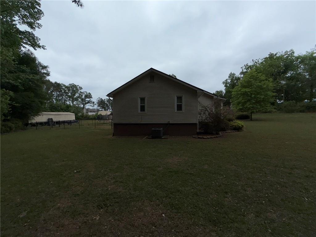 217 Babbs Mill Road Hampton, GA 30228 - Photo 12 of 39 a house view with a garden space