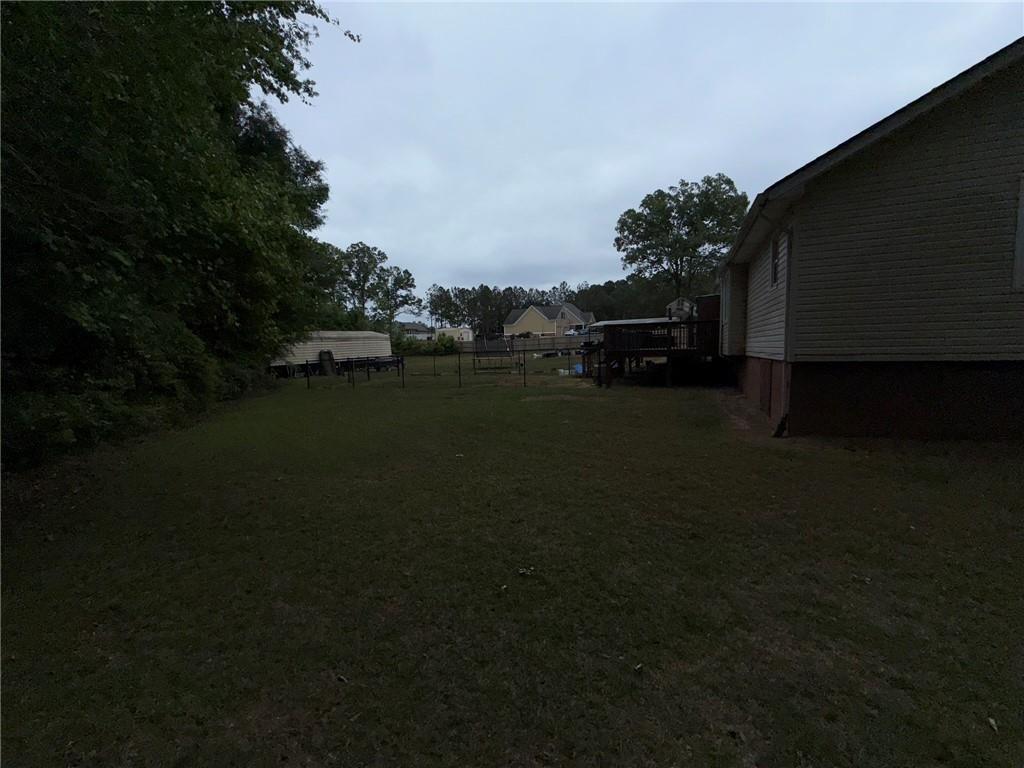 217 Babbs Mill Road Hampton, GA 30228 - Photo 14 of 39 a view of house with garden space and lake view
