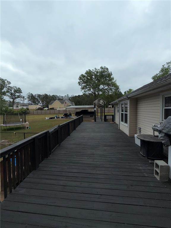 217 Babbs Mill Road Hampton, GA 30228 - Photo 16 of 39 a terrace with outdoor seating and city view