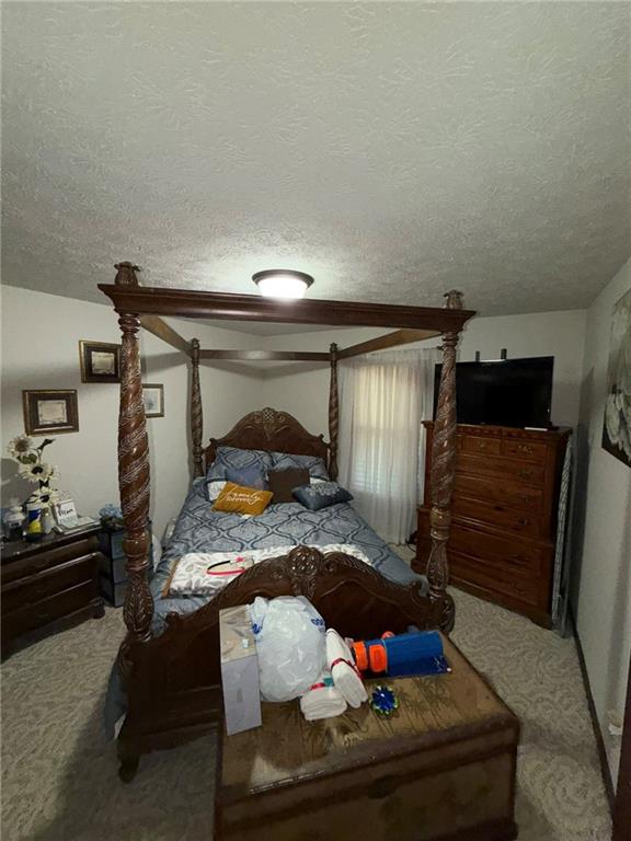 217 Babbs Mill Road Hampton, GA 30228 - Photo 21 of 39 a bedroom with furniture and window