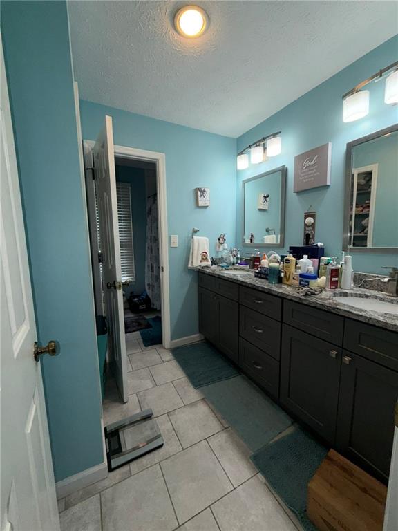 217 Babbs Mill Road Hampton, GA 30228 - Photo 22 of 39 a spacious bathroom with a mirror and a sink