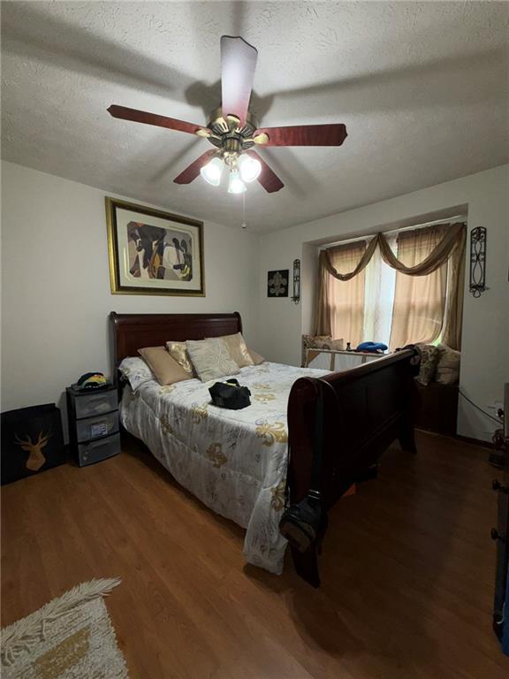 217 Babbs Mill Road Hampton, GA 30228 - Photo 25 of 39 a bedroom with a bed furniture and a window