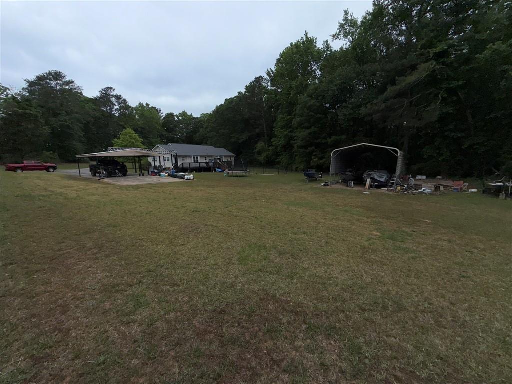 217 Babbs Mill Road Hampton, GA 30228 - Photo 32 of 39 a front view of a house with garden