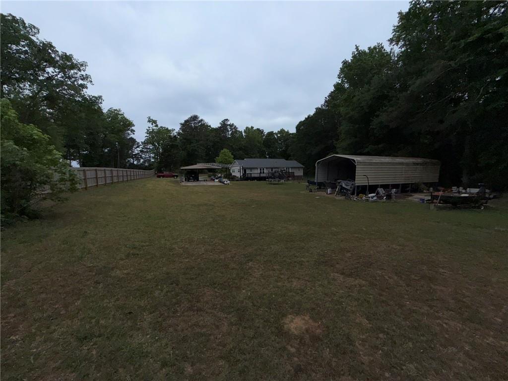 217 Babbs Mill Road Hampton, GA 30228 - Photo 33 of 39 a view of outdoor space with deck and yard