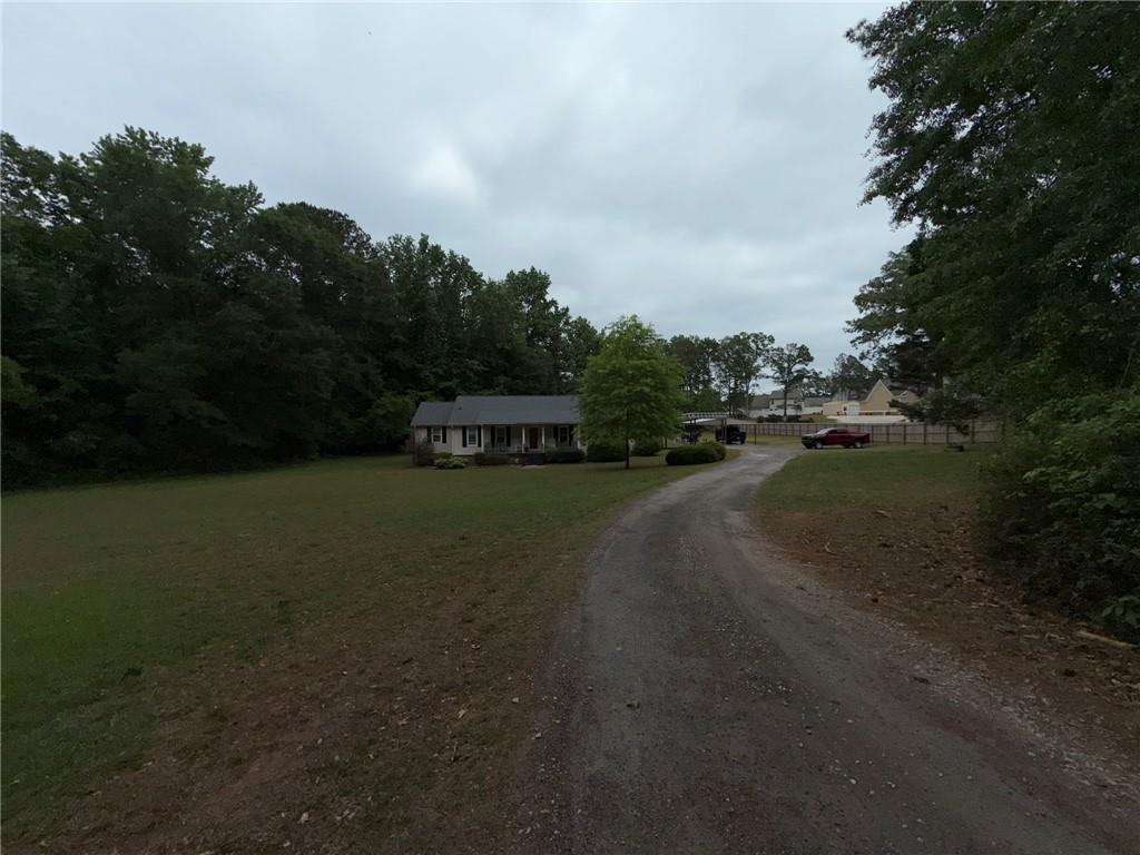 217 Babbs Mill Road Hampton, GA 30228 - Photo 37 of 39 a view of street and car parked