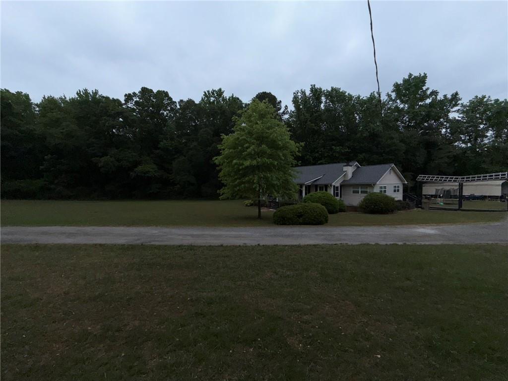217 Babbs Mill Road Hampton, GA 30228 - Photo 10 of 39 a view of yard with seating area and trees