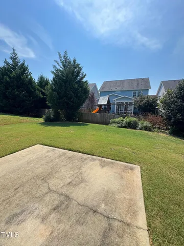 a view of a street with a building in the background