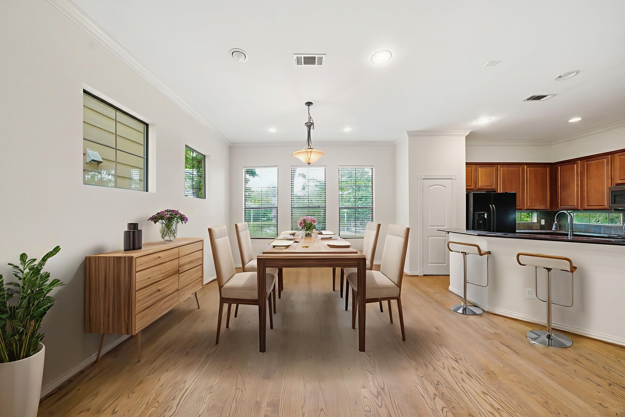 5310 Larkin Street, Unit B Houston, TX 77007 - Photo 11 of 36 a view of a dining room with furniture window and wooden floor