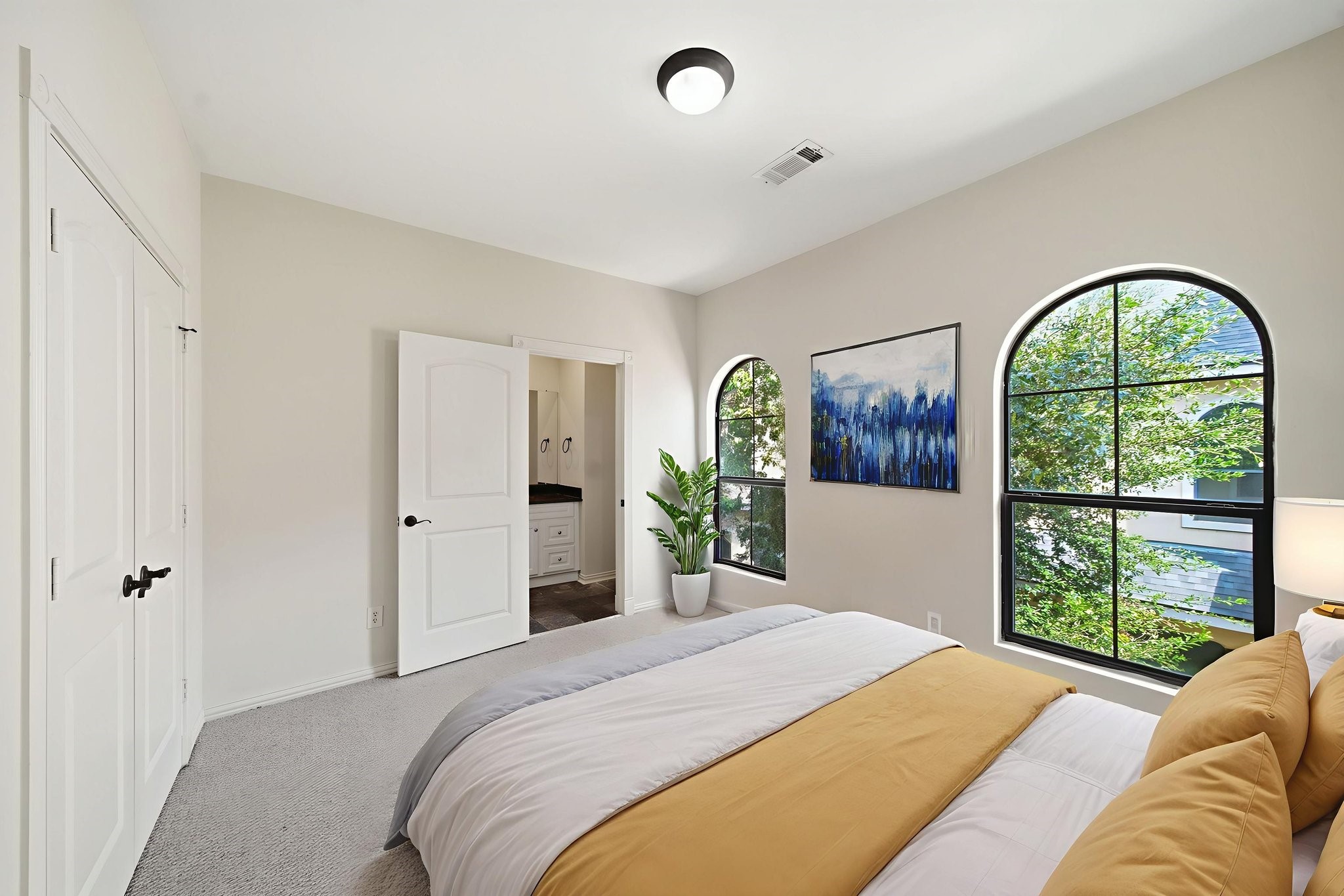 5310 Larkin Street, Unit B Houston, TX 77007 - Photo 19 of 36 a bedroom with a bed and a large window