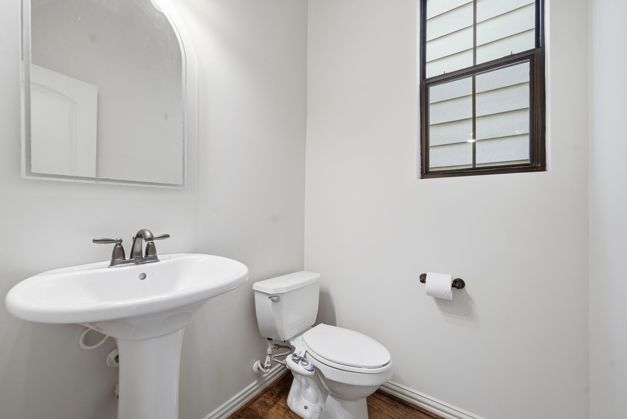 5310 Larkin Street, Unit B Houston, TX 77007 - Photo 25 of 36 a bathroom with a sink mirror and toilet